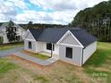 New house with gray and white siding, a dark roof, and a small yard at 9605 Hwy 52 N None # 4, Wadesboro, NC 28170