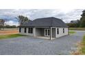 Gray vinyl-sided house with a gray roof and a covered patio at 9617 Hwy 52 N None # 3, Wadesboro, NC 28170
