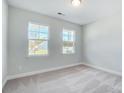 Spacious bedroom with neutral walls and carpeted floors at 109 S Dunlavin Way # 62, Mooresville, NC 28115