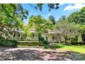 House exterior showcasing a large front porch and mature landscaping at 205 Vauxhall Dr, Shelby, NC 28150