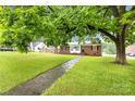 Ranch house with mature landscaping and a walkway at 1603 Spencer Mountain Rd, Gastonia, NC 28054