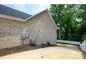 Brick home exterior showcasing AC unit and driveway at 539 N C Ave, Maiden, NC 28650