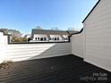 View from rooftop deck, showcasing additional townhomes and a clear sky at 1211 E 34Th St # Csw0313, Charlotte, NC 28205