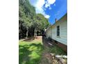 Side yard with mature trees, providing a natural border at 3130 Faith Rd, Salisbury, NC 28146