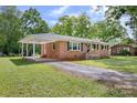 Brick ranch home with covered porch and gravel driveway at 1900 Sigmon Dairy Rd, Newton, NC 28658