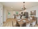 Eat-in kitchen with white cabinets and granite countertops at 271 Malvern Dr, Concord, NC 28025