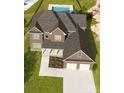 Aerial view of house with two-car garage and landscaping at 0000 Lake Shore S Rd # 152, Denver, NC 28037
