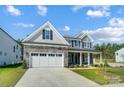 Two story house with gray siding and stone accents at 2004 Cedar Falls Dr # 4, Waxhaw, NC 28173