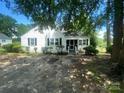 White house with lawn and driveway at 6401 N Matson St, Kershaw, SC 29067