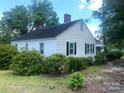 White house side view, landscaping at 6401 N Matson St, Kershaw, SC 29067
