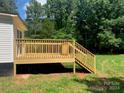 Wooden deck with railing attached to a manufactured home at 7067 Citation St, York, SC 29745