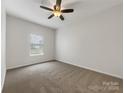 Bright bedroom with neutral walls and plush carpeting at 24589 Blue Heron Cir, Lancaster, SC 29720