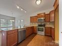 Modern kitchen featuring granite countertops and stainless steel appliances at 24589 Blue Heron Cir, Lancaster, SC 29720