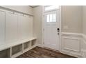 Entryway with built-in bench, storage, and hardwood floors at 6280 Culbert St # 190, Harrisburg, NC 28075