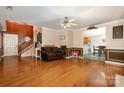 Living room with hardwood floors and view into dining area at 1820 Oakdale Green Dr, Charlotte, NC 28216