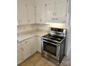 Bright kitchen with white cabinets, stainless steel appliances, and granite countertops at 2819 Royal Ridge Ln, Charlotte, NC 28212