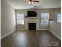 Spacious living room features a fireplace and wood-look floors at 2264 Mancke Dr, Rock Hill, SC 29732