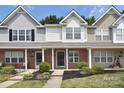 Two story townhome with gray and white exterior at 12914 Mosby Ln, Charlotte, NC 28273