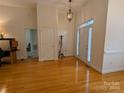 Bright and spacious entryway with hardwood floors and coat rack at 5916 Meadowmere Dr, Monroe, NC 28110