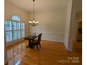 Formal dining room with hardwood floors and a chandelier at 5916 Meadowmere Dr, Monroe, NC 28110