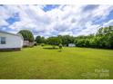 Large backyard with a shed and mature trees at 707 Cool Spring Rd, Statesville, NC 28625