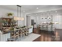 Open dining room and kitchen with large island at 3314 Lakeside Dr, Charlotte, NC 28270