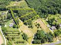 Aerial view of two lots of land with surrounding houses at 10910 Archer Rd, Davidson, NC 28036