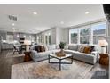Spacious living room with sectional sofa and large windows at 5309 Kinsbridge Dr, Mint Hill, NC 28227