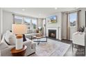 Cozy living room with fireplace and ample natural light at 5309 Kinsbridge Dr, Mint Hill, NC 28227