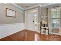 Entryway with hardwood floors and white trim at 8714 Brideswell Ln, Charlotte, NC 28278