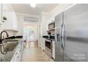 Modern kitchen with stainless steel appliances and granite countertops at 4198 Pickering Dr, Hickory, NC 28602