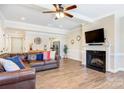 Spacious living room featuring a fireplace, hardwood floors, and comfortable leather sofas at 4198 Pickering Dr, Hickory, NC 28602