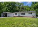 Single-wide mobile home with metal roof, and carport at 1219 Neely Smith Ln, Gastonia, NC 28056