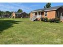 Two brick homes on a spacious lot at 835 Sikes Mill Rd, Monroe, NC 28110