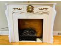 Decorative fireplace with gold accents and a lion head at 35 Marsh Ave, Wadesboro, NC 28170