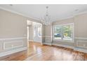 Bright dining room with hardwood floors and chandelier at 101 Mcalway Rd, Charlotte, NC 28211