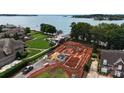 Lakefront lot showing foundation work underway at 108 Sail High Ct, Mooresville, NC 28117