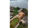 Lakefront property under construction with expansive water views at 108 Sail High Ct, Mooresville, NC 28117