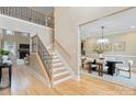 Two-story entryway with staircase and views to dining room and living room at 4023 Randolph Rd, Charlotte, NC 28211