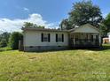 Single wide mobile home with covered porch and yard at 100 Springs Ct, Stony Point, NC 28678