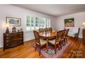 Formal dining room with wood floors and large windows at 925 Henkel Rd, Statesville, NC 28677