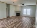 Spacious living room featuring a fireplace and wood-look flooring at 200 Olin Loop, Olin, NC 28660