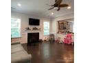 Living room with fireplace and open floor plan at 2044 Sweet William Dr, Harrisburg, NC 28075