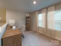 Charming home office featuring built-in shelving and window seating at 2011 Merida St, Charlotte, NC 28214