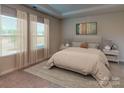 Spacious bedroom with large windows and plush carpeting at 2011 Merida St, Charlotte, NC 28214