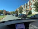 Row of townhouses with parking in front at 9416 Sandburg Ave, Charlotte, NC 28213