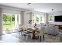 Open concept dining room with sliding glass doors leading to backyard at 1008 Briar Well St, Mint Hill, NC 28227