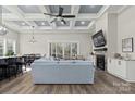 Open living space with fireplace and coffered ceiling at 001 Beatties Ford Rd, Huntersville, NC 28078