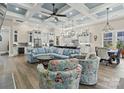Open floor plan great room with high ceilings, hardwood floors, and a cozy seating area at 001 Beatties Ford Rd, Huntersville, NC 28078