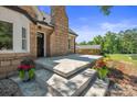 Stone steps leading to a charming front porch with planters at 2120 Old Salisbury Concord Rd, Concord, NC 28025